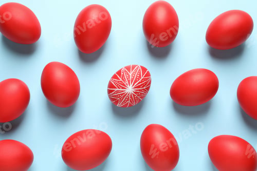 Preview: Flat lay composition of red Easter eggs on color background
