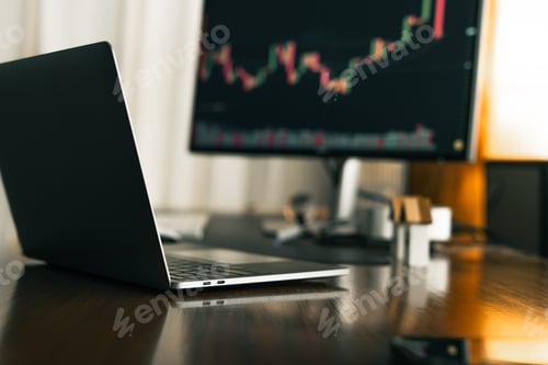 Preview: Home office desk background with laptop and stock chart display.