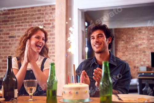 Preview: Multi-Cultural Group Of Friends Celebrating Birthday With Party And Cake At Home Together
