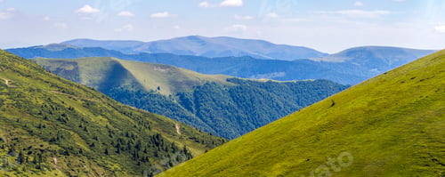 Preview: Panorama of green hills in summer mountains