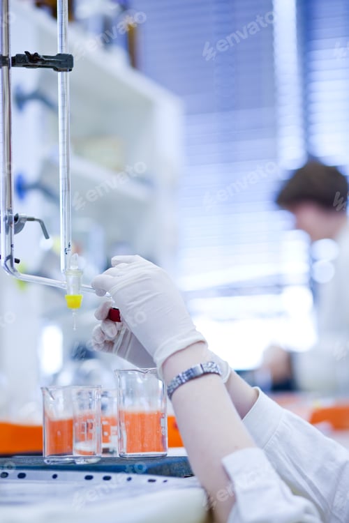 Preview: portrait of a female researcher carrying out research in a chemi