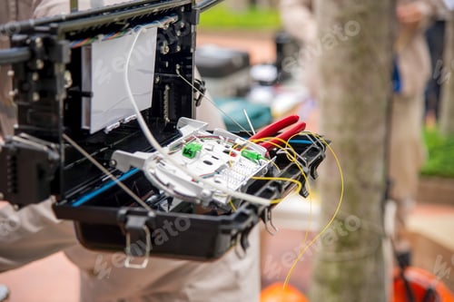 Preview: Technicians are install cabinet on fiber optic cable.