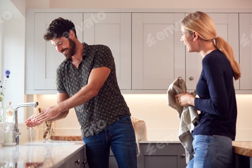Preview: Couple Washing Hands With Soap At Home To Stop Spread Of Infection In Health Pandemic