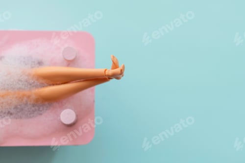 Preview: Doll legs in pink bath 🛁 on blue pastel background