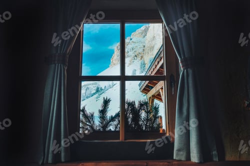 Preview: A mountain view through a window in a wooden chalet