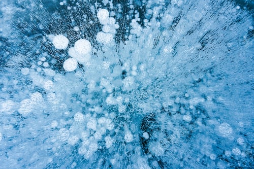 Preview: Natural ice bubbles on frozen lake in wintertime
