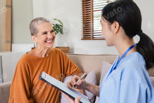 Preview: A female nurse holds a document collecting health examination information and recommends health