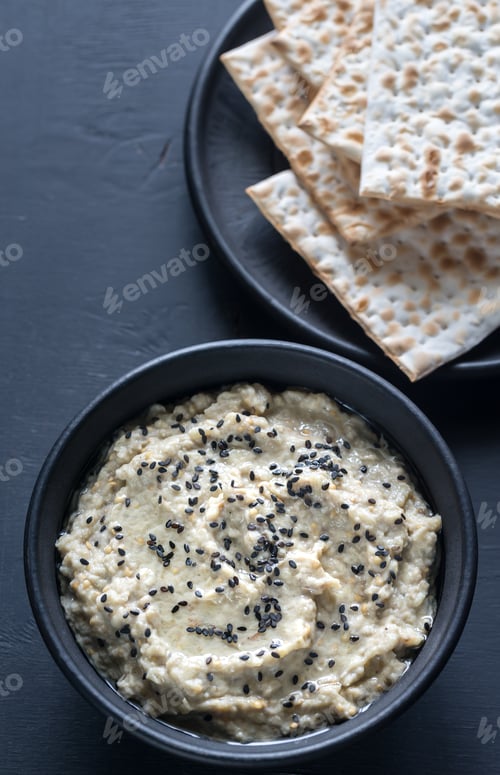 Preview: Bowl of baba ghanoush with matzo