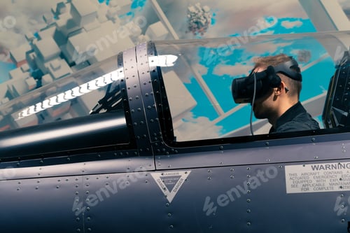 Preview: boy sitting in flight simulator military plane wearing virtual reality glasses flight entertainment