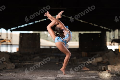 Preview: Young girl performing rhythmic gymnastics exercises outdoors