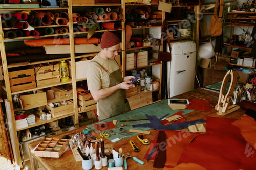 Preview: Male Tailor Looking at Leather Workpiece