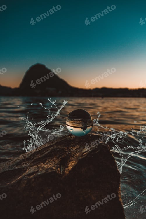 Preview: Close-up of crystal ball with reflection in water