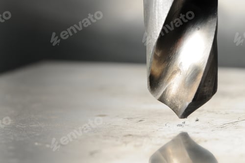 Preview: Metal drill close-up, blurred background
