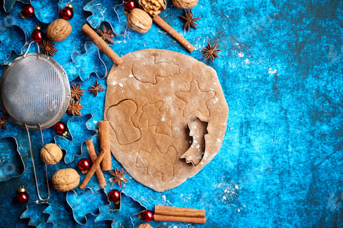 Preview: Christmas baking concept. Gingerbread dough with different cutter shapes