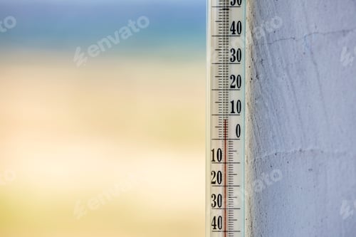 Preview: Alcohol glass thermometer Celsius outside on bright blurred light outdoors copy space background