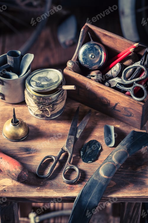 Preview: Closeup of bicycle repair workshop with tools, wheels and tube