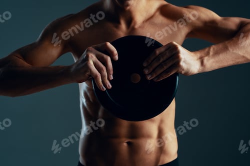 Preview: man with a pumped up body exercise muscle workout