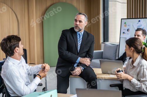 Preview: Group of multi-Ethnic businessman and businesswoman working in office.