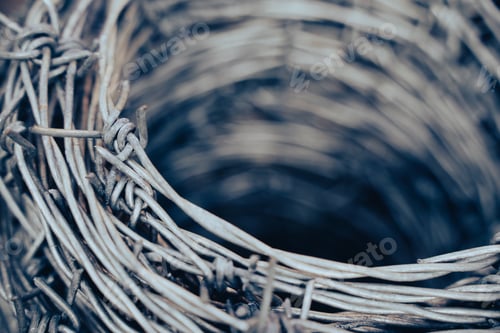 Preview: macro detail of roll of steel barbed wire