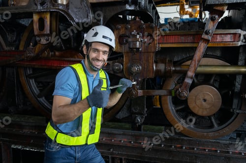Preview: Portrait of Engineer train Inspect the train's diesel engine, railway track in depot of train