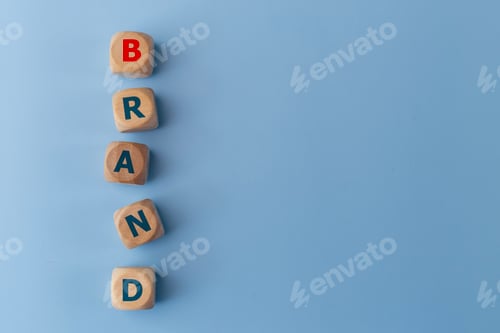 Preview: Word BAND on wooden cubes on a blue background. Business concept. Brand identity