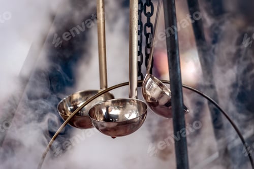 Preview: Campfire smoke wrapped hot wine pouring ladles.