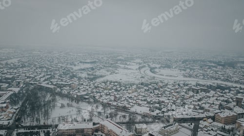 Preview: Landscape of a small town covered in the snow and fog on a gloomy day in Bosnia and Herzegovina