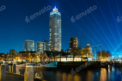 Preview: Panoramic view of the night city. Rotterdam city skyline. City towers illuminated panorama