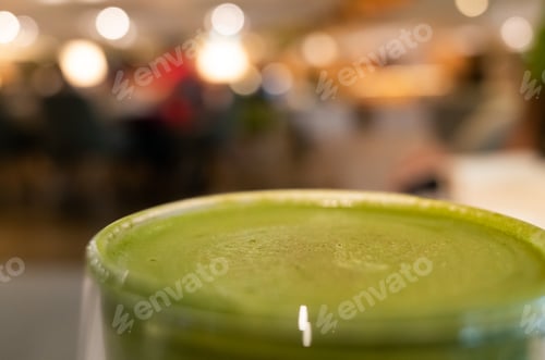 Preview: Cup Of Matcha Milk Tea On Table In A Coffee Shop