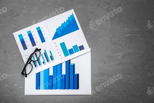Preview: Financial paper with charts and diagrams on gray table