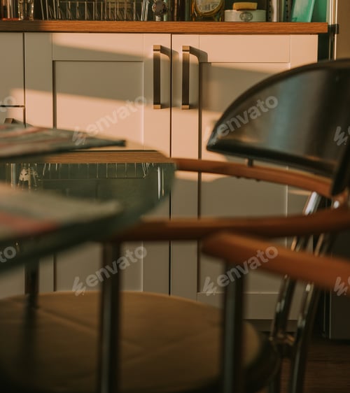 Preview: A modern kitchen in a open space apartment at sunset