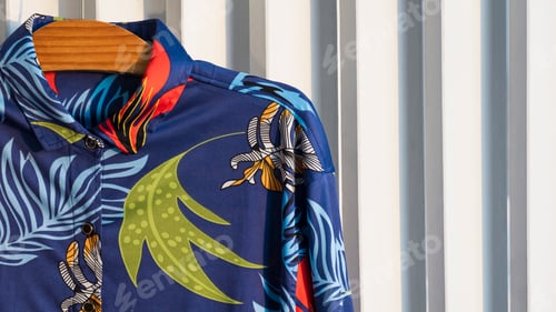 Preview: Blue Shirt with Floral Pattern on Wooden Hanger