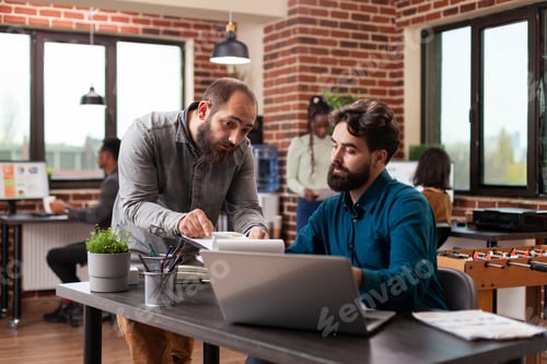 Preview: Busy executive managers analysing marketing statistics
