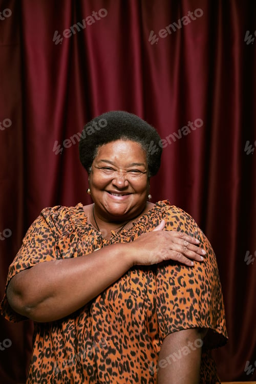 Preview: Portrait of Middle Aged Black Woman Smiling and Posing in Photo Booth