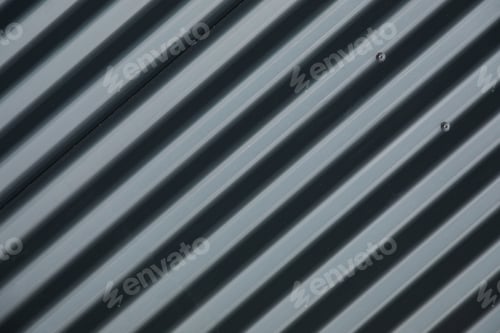 Preview: Diagonal close-up of striped ribbed metal surface