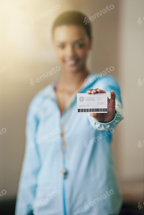 Preview: Need a personal trainer. Shot of a gym trainer showing her identification card.