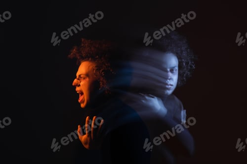 Preview: double exposure of depressed and angry african american man with bipolar disorder shouting on dark