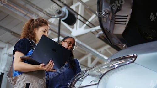 Preview: Technician does checkup on client car