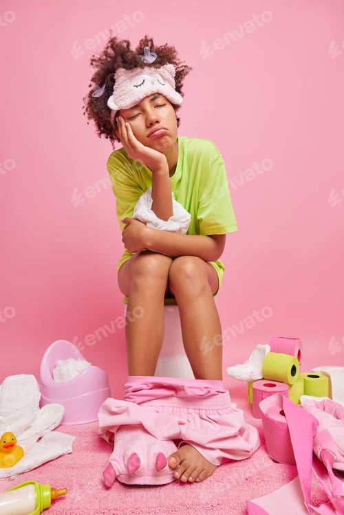 Preview: Sleepy tired mother of little baby has sleepless night wears blindfold t shirt shorts has nipples st