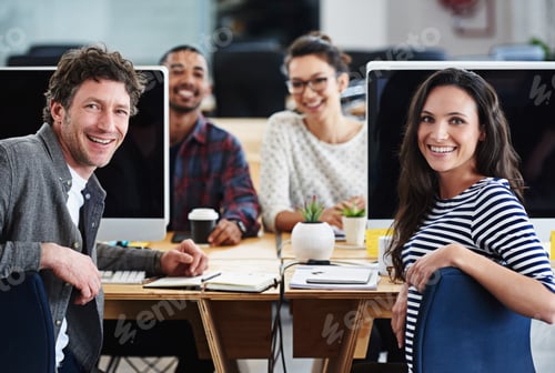 Preview: Make creativity a job. Portrait of a group of young office workers sitting at their computers.