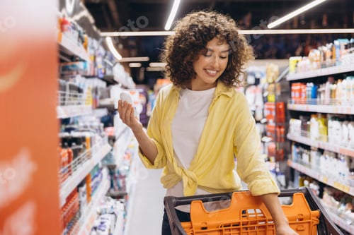 Preview: Smiling Woman Choosing Deodorant in Supermarket