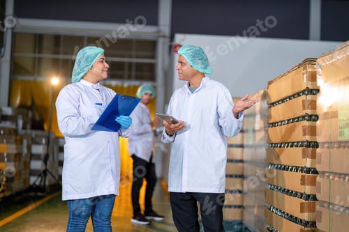 Preview: In warehouse quality control team checking drinking bottle stack on pallet before delivery
