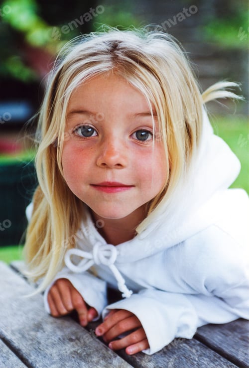 Preview: Portrait of girl wearing white hoody leaning on park picnic table