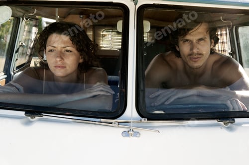 Preview: View through windscreen of couple in campervan