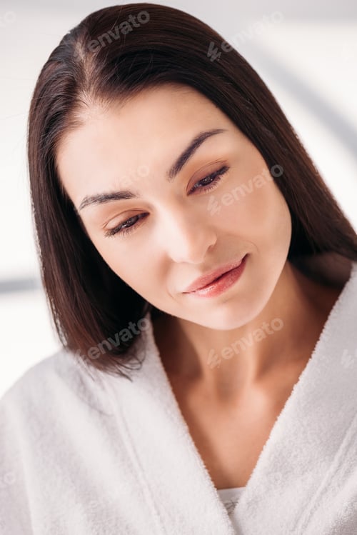Preview: Portrait of young woman with fresh skin wearing white bathrobe