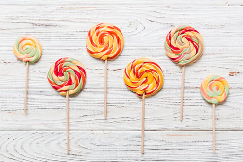 Preview: Set of colorful lollipops on colored background. Summer concept. Party