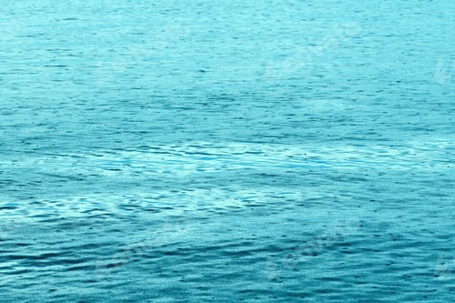 Preview: Sudden summer shower rain at seaside, raindrops forming patterns on water surface