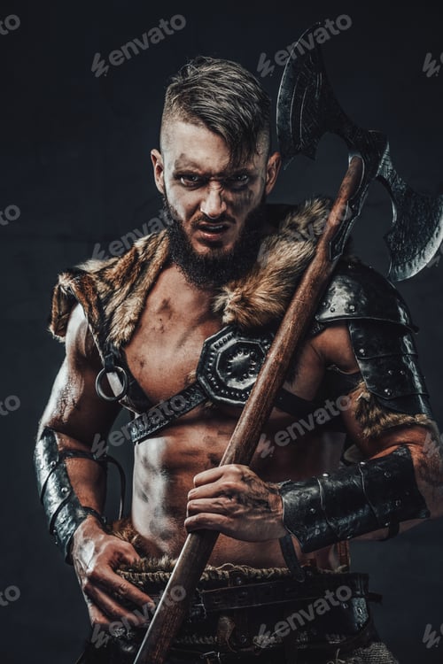 Preview: Brutal scandinavian warrior with armed with axe in dark background