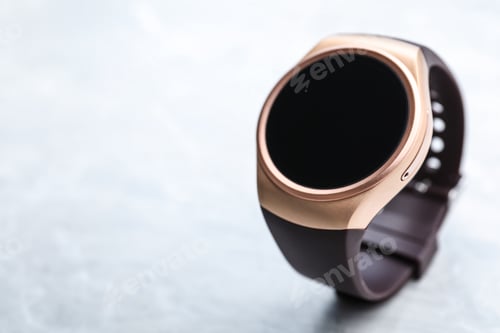 Preview: Trendy smart watch on light stone table, space for text
