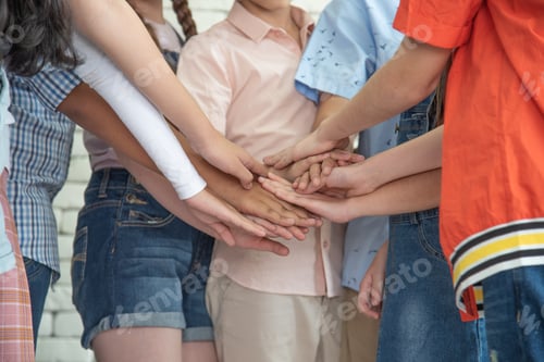 Preview: International elementary school girls and boys join hands work together as team
